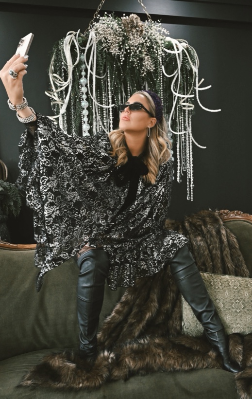 Ashleigh Malangone in silver lace on a velvet sofa